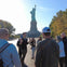 A captivating photo of our tour group at Ellis Island with the majestic Statue of Liberty as the backdrop.