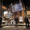 Visitors inside a museum exhibit featuring large steel beams and informational displays about Ground Zero.