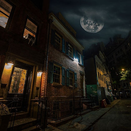 Spooky nighttime photo of the 12 Gay Street in New York with a spooky skies overhead