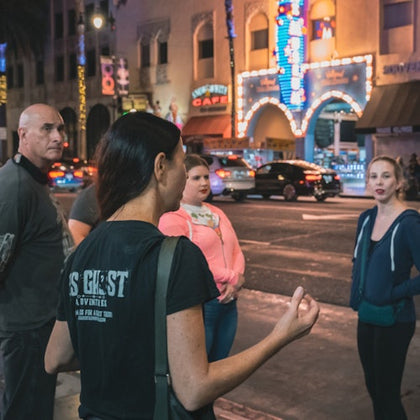Tour guide sharing haunting stories during the tour