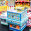 LEGO ice cream shop with a sign that reads "40 Different Flavors," surrounded by other colorful LEGO food stands.