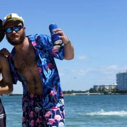 Friends toasting on a boat with a city backdrop—savoring the moment in style on urban waters.