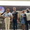 Guests stop for photos in front of the "View from the Moon" during the Astroville Tunnel Tour of Downtown Houston.