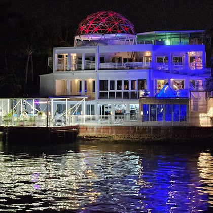 Celebrity home lit up at night