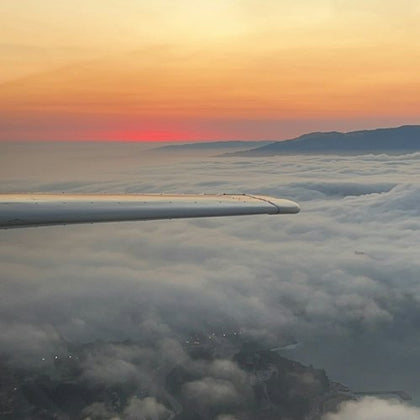 Sunset over the clouds