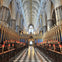 A grand cathedral interior with vaulted ceilings, ornate decorations, and a checkered floor leading to a stained glass window.