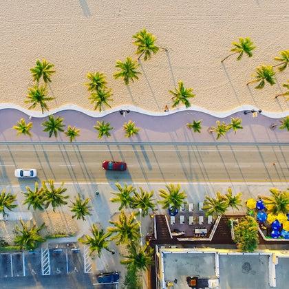 Aerial photo of a road next to the beach