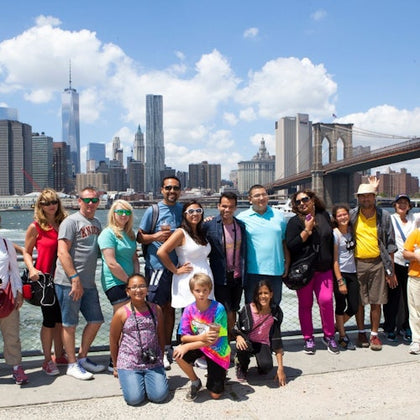 A captivating snapshot of our tour guest enjoying the stunning waterfront view of the Brooklyn Bridge.
