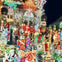A house decorated with numerous Christmas-themed ornaments, including nutcrackers, lights, and festive figures at night.