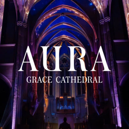 Interior of a cathedral with illuminated arches and text overlay reading 'Aura Grace Cathedral.'