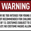 A warning sign stating that content may be intense for young children, not recommended for under 13, and costume rules apply.