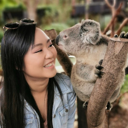 Female getting a photo with a koala