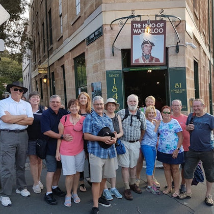 A group standing outside The Hero of Waterloo