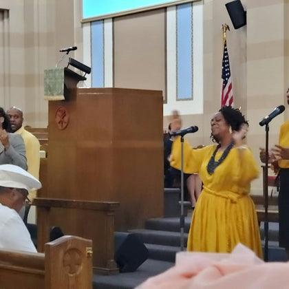 An inspiring image of a vibrant Gospel Choir passionately singing.