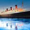 An illuminated ocean liner with three red and black smokestacks is docked at twilight, reflected in calm water.