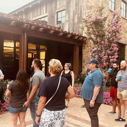 Tour group enjoying drinks and stories